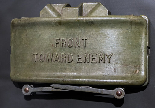 Claymore Mine, an anti-personnel mine lying on fabric