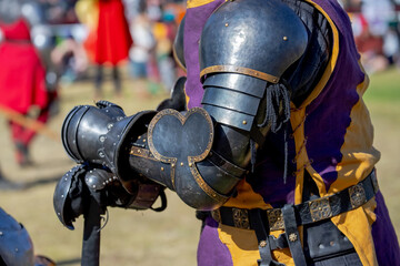 Elements of medieval iron knight armor for battle, helmet, spaulders, pouldrons, vambraces,...