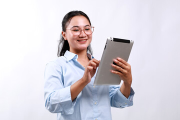 Smiling busy young asian business woman manager using tablet computer, happy business woman...