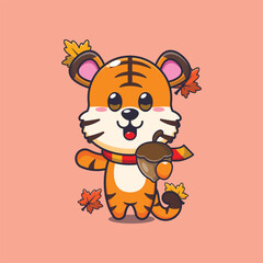 Cute tiger with acorns at autumn season