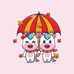 Cute couple unicorn with umbrella at autumn season