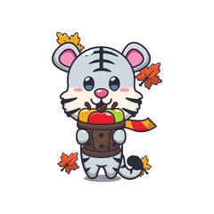 Obraz premium Cute white tiger holding a apple in wood bucket
