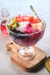 Es buah or sop buah-is an Indonesian iced fruit cocktail dessert. This cold and sweet beverage is made of diced fruits mixed with shaved ice or ice cubes, and sweetened with liquid sugar or syrup
