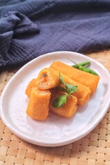 vegetable risole on white plate with cayenne pepper 