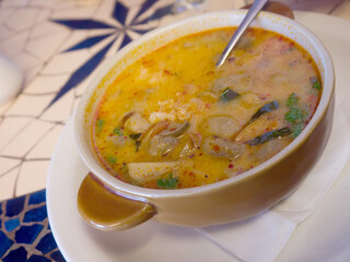 Big Bowl of creamy Thai Tom yum seafood soup 