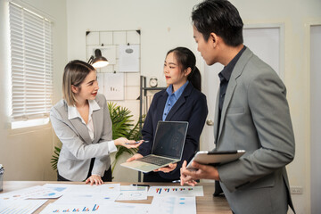 Asian businessmen, women and men Talk about new projects, presents at home office.