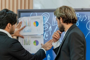 Two businessmen discussing a project.