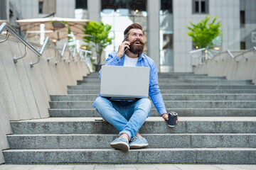 cheerful man with freelance communication talk on phone. man with freelance communication