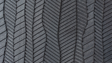 close-up view of sole of shoe pattern, abstract of black rubber textured and grooves surface of...