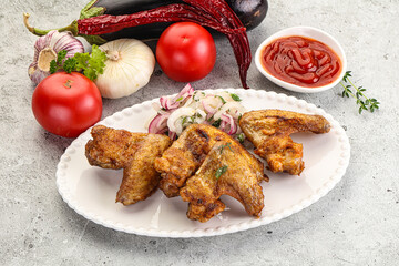 Grilled chicken wings with sauce