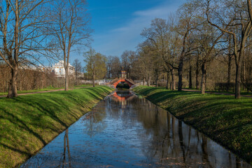 Cross bridge (Krestovy bridge) in the Alexander Park of Tsarskoye Selo on a sunny spring day,...