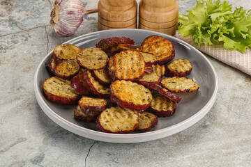 Baked red batat slices with herbs