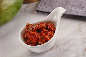 Spicy pickled raw green mango