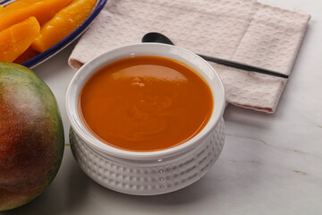 Sweet mango puree in the bowl