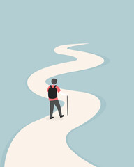 Obraz premium A manwith backpack and hiking pole is walking along a winding path.