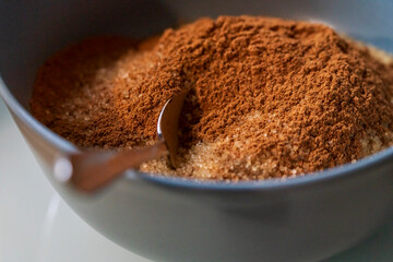Close up view to a sugar and cinnamon mix at the kitchen