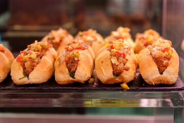 Spanish tapas hot dogs on a tray at the market