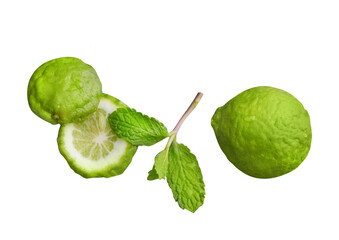 Green fresh Lemon Full and sliced with mint leaf isolated on white background