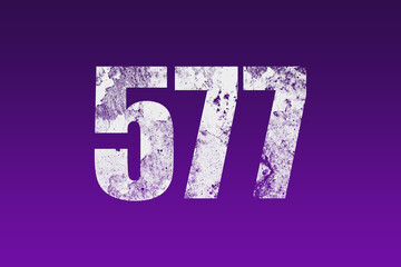 flat white grunge number of 577 on purple background.