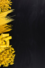 pasta on black wooden background