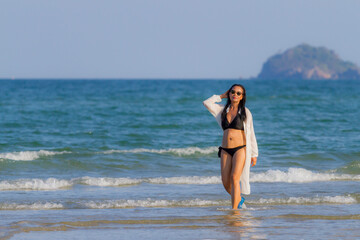 Woman body pretty with black  bikini on beach
