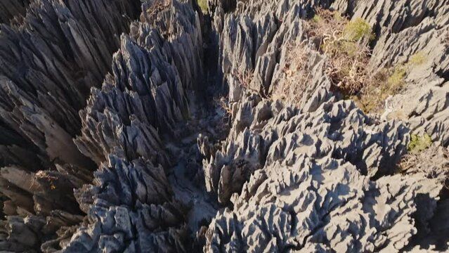 Aerial drone view of beautiful big Tsingy de Bemaraha - stone formation and huge national park in Madagascar. (4K)