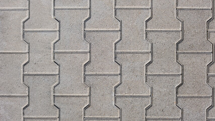 interlocking block paving background beige grey