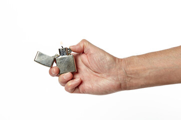 Hand hold holding lighter, isolated on white background. The fire is burning. Cool Metallic Lighter...