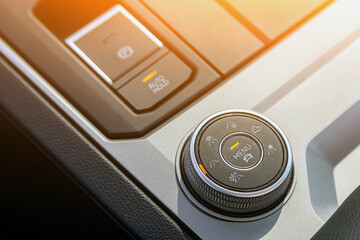 Close-up of the suspension control button, adjusting the movement of the car on various types of surfaces