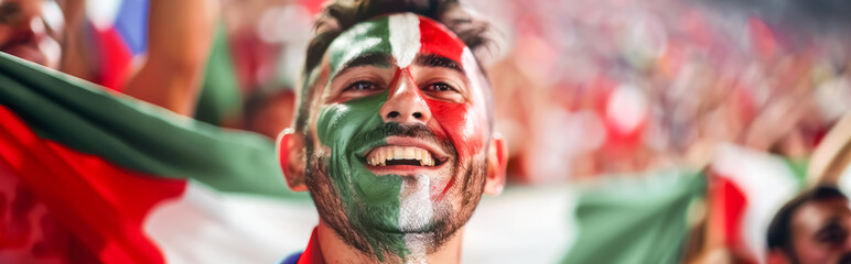 Happy Italian male supporter with face painted in Italian flag, Italian male fan at a sports event