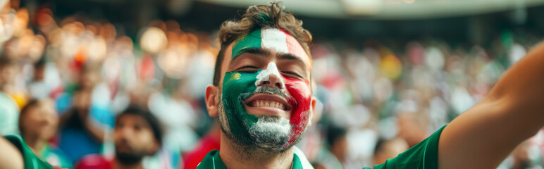 Happy Italian male supporter with face painted in Italian flag, Italian male fan at a sports event