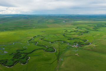 Aerial photography of the nine twists and turns of the Uragai River in the Uragai Grassland in...