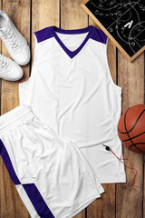 Basketball uniform on wooden background top view