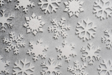 White snowflakes on a gray background
