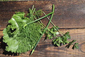 Top view of green vegetables on rustic table, close up