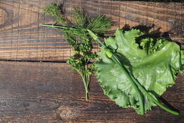 Top view of green vegetables on rustic table, close up