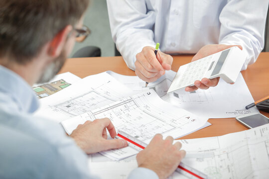 two architects talking during meeting