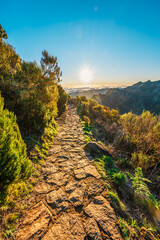 Hiking on the highest peak of Madeira Pico Ruivo next to the cottage Abrigo do Pico Ruivo. Views of...