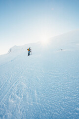 Mountaineer backcountry ski walking ski alpinist in the mountains. Ski touring in alpine landscape...