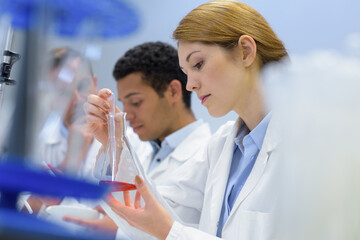 man and woman are in lab