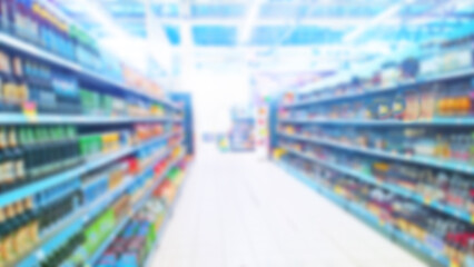 Abstract blur image of supermarket background. Defocused shelves with CPG product, food. Grocery shopping. Store. Retail industry. Rack. Discount. Inflation and crisis concept. Aisle. Increased demand