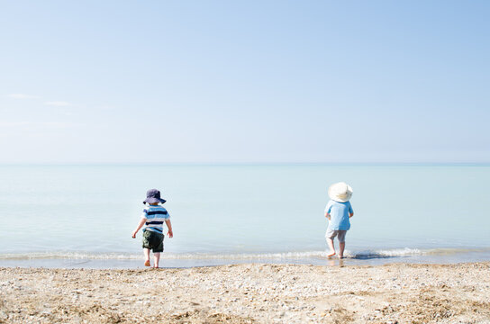 Children playing in gentle surf on Lake Huron
