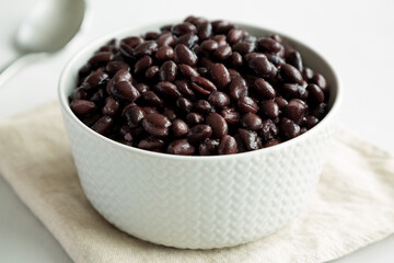 Homemade Preserved Black Beans in a Bowl, side view.