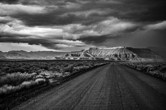 Storm clouds over a mesa and gravel road near Zion National Park, Uta