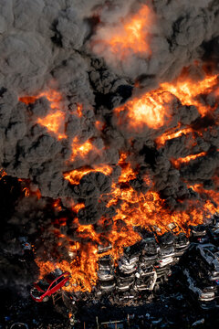 A massive fire burns through a junkyard in Philadelphia, as seen