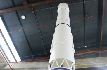 Small satellite rocket in space center.