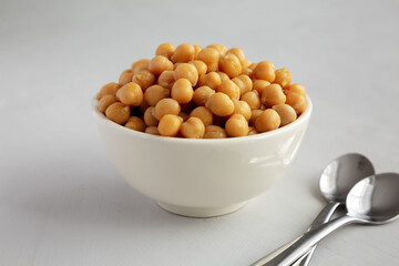 Homemade Preserved Chickpeas in a Bowl, side view. Close-up.