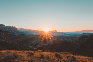 Naklejka premium Golden Sunrise Over Desert Mountains
