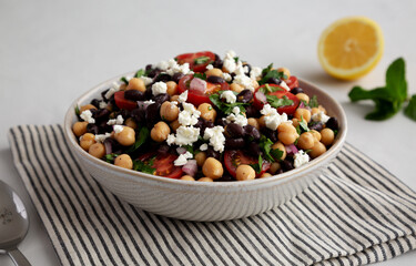 Homemade Chickpea And Black Bean Salad in a Bowl, low angle view.