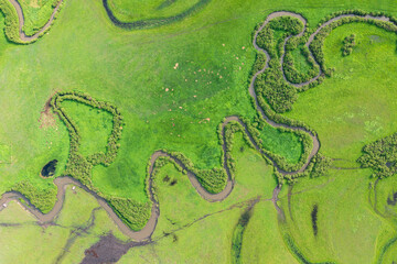 Aerial photography of the nine twists and turns of the Uragai River in the Uragai Grassland in...